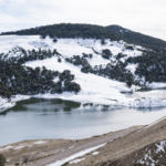 Scenic view of the Middle Atlas Mountains during a day trip to the Middle Atlas, showcasing lush cedar forests and serene landscapes.